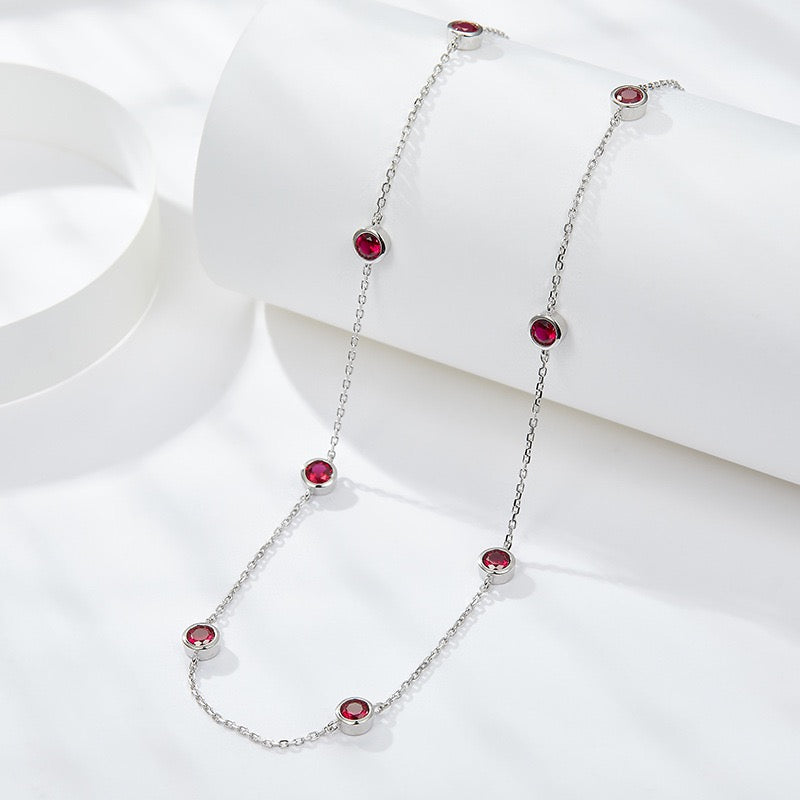 Europe and America ins wind stacked wearing a 4.0mm round cultured ruby silver plated 18k gold bubble chocker short necklace.
