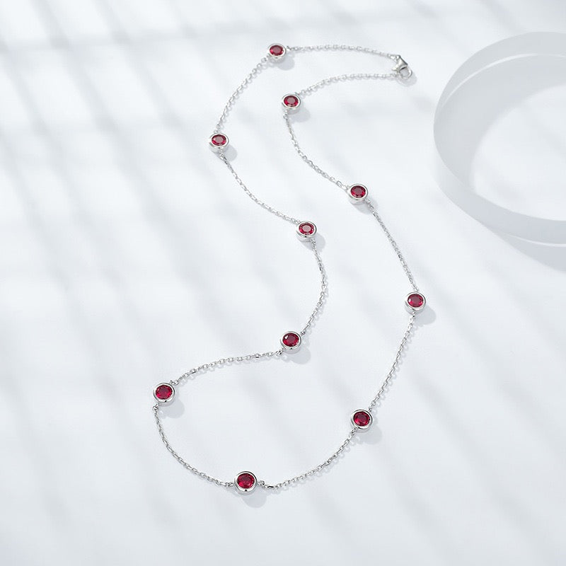 Europe and America ins wind stacked wearing a 4.0mm round cultured ruby silver plated 18k gold bubble chocker short necklace.
