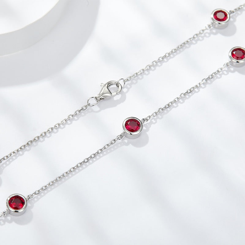 Europe and America ins wind stacked wearing a 4.0mm round cultured ruby silver plated 18k gold bubble chocker short necklace.
