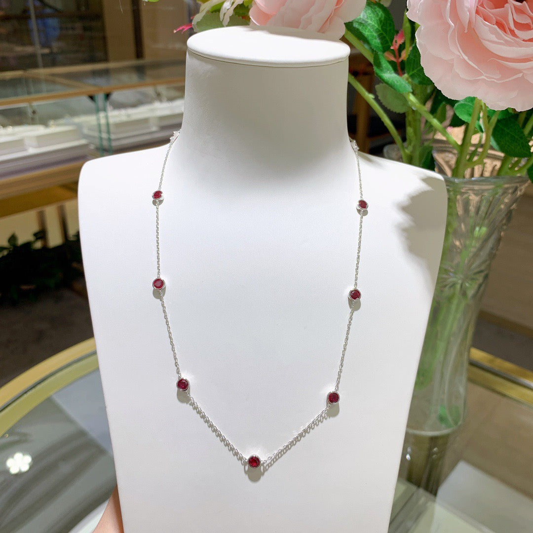 Europe and America ins wind stacked wearing a 4.0mm round cultured ruby silver plated 18k gold bubble chocker short necklace.